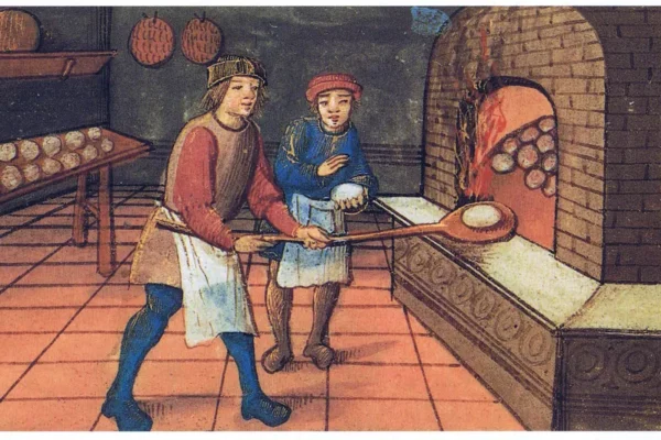 a man and woman cooking in a medieval kitchen